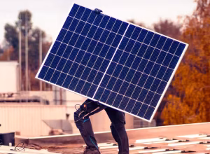 Hand holding a photovoltaic module as a symbol for project enquiries – EPC Photovoltaics Germany