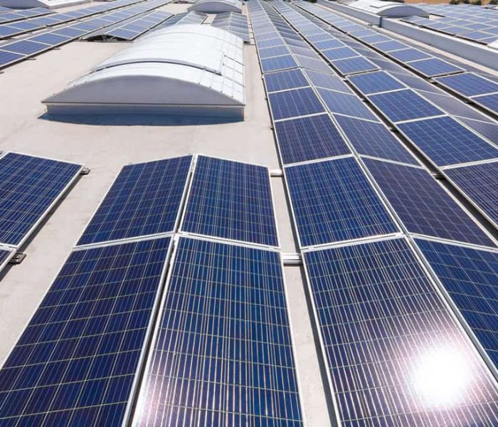 Solar modules on a flat roof with light domes