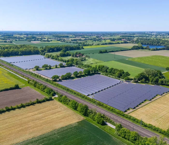 Aerial view of the Ennigerloh-Oelde solar park along a railway line